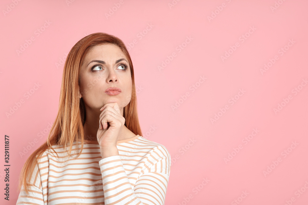 Pensive woman on pink background, space for text. Thinking about answer to question Pensive woman on pink background, space for text. Thinking about answer to question