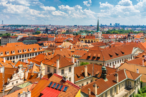 Old town of Prague. Czech Republic over river Vltava with Charles Bridge on skyline. Prague panorama landscape view with red roofs. Prague view from Petrin Hill, Prague, Czechia.