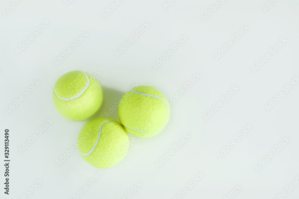 Three tennis Ball Sport Equipment on White Background using as World Competition Concept