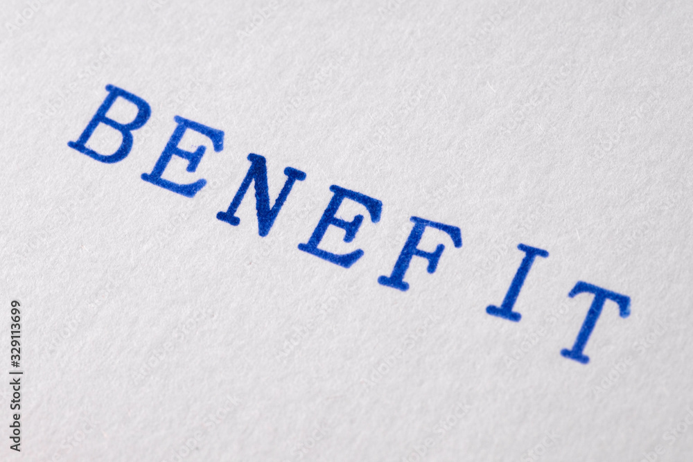 a benefit word stamped on a piece of paper. a benefit word stamped on a piece of paper.