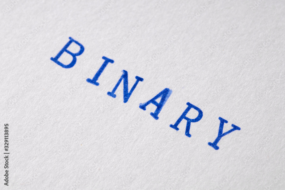 a binary word stamped on a piece of paper. a binary word stamped on a piece of paper.