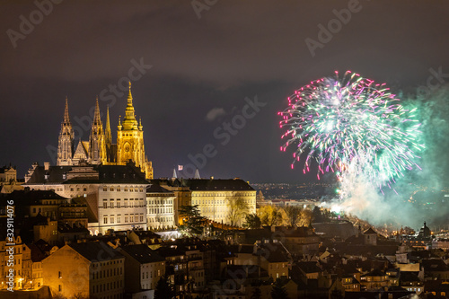 Fireworks over the Old Town of Prague  Czech Republic. New Year fireworks in Prague  Czechia. Prague fireworks during New Year Celebration near St. Vitus Cathedral  Prague  Czech republic.