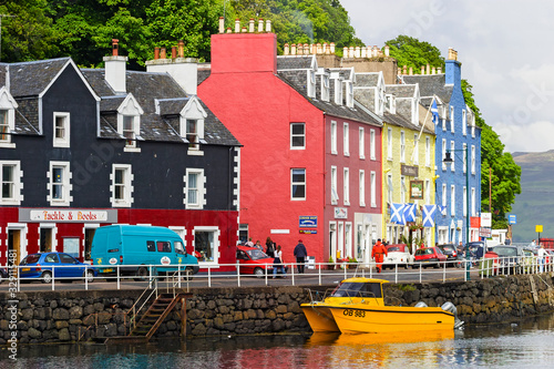 City street at colourful houses in the port of Tobermory in Scotland photo