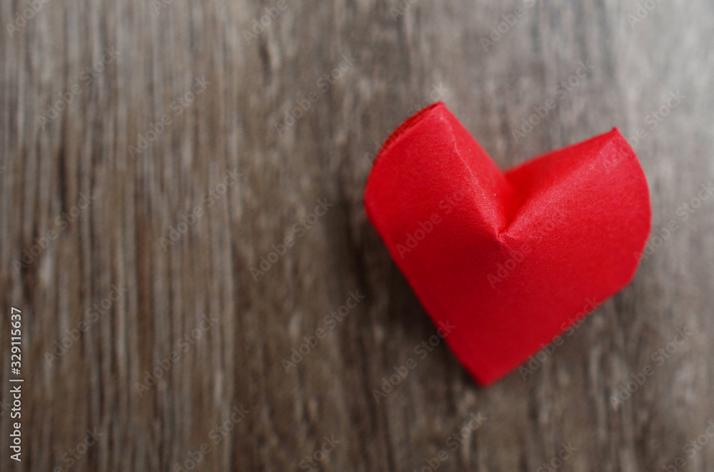 Fototapeta premium A origami red heart folded