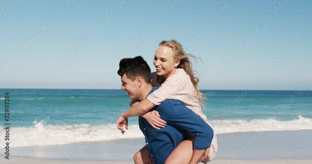 Couple in love enjoying free time on the beach together Couple in love enjoying free time on the beach together