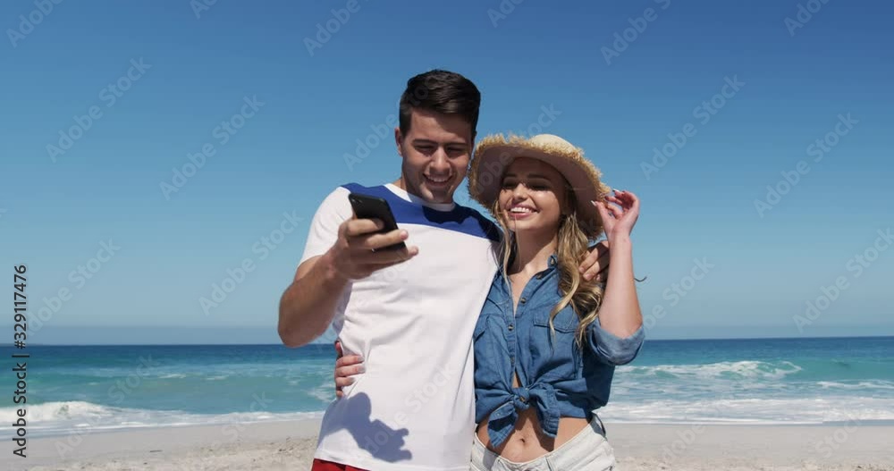 Couple in love enjoying free time on the beach together Couple in love enjoying free time on the beach together