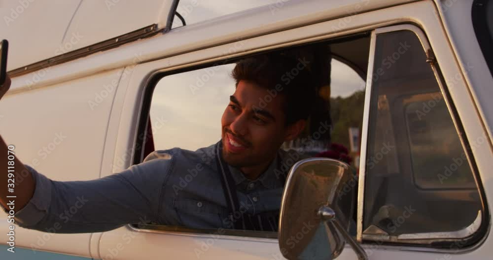 Young man taking selfies in the food truck Young man taking selfies in the food truck