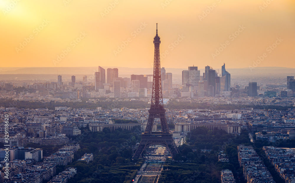 Fototapeta Panoramic aerial view of Paris, Eiffel Tower and La Defense business district. Aerial view of Paris at sunset. Panoramic view of Paris skyline with Eiffel Tower and La Defense. Paris, France.