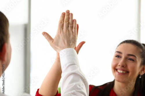 Happy workers in office celebrating new corporate achievement photo