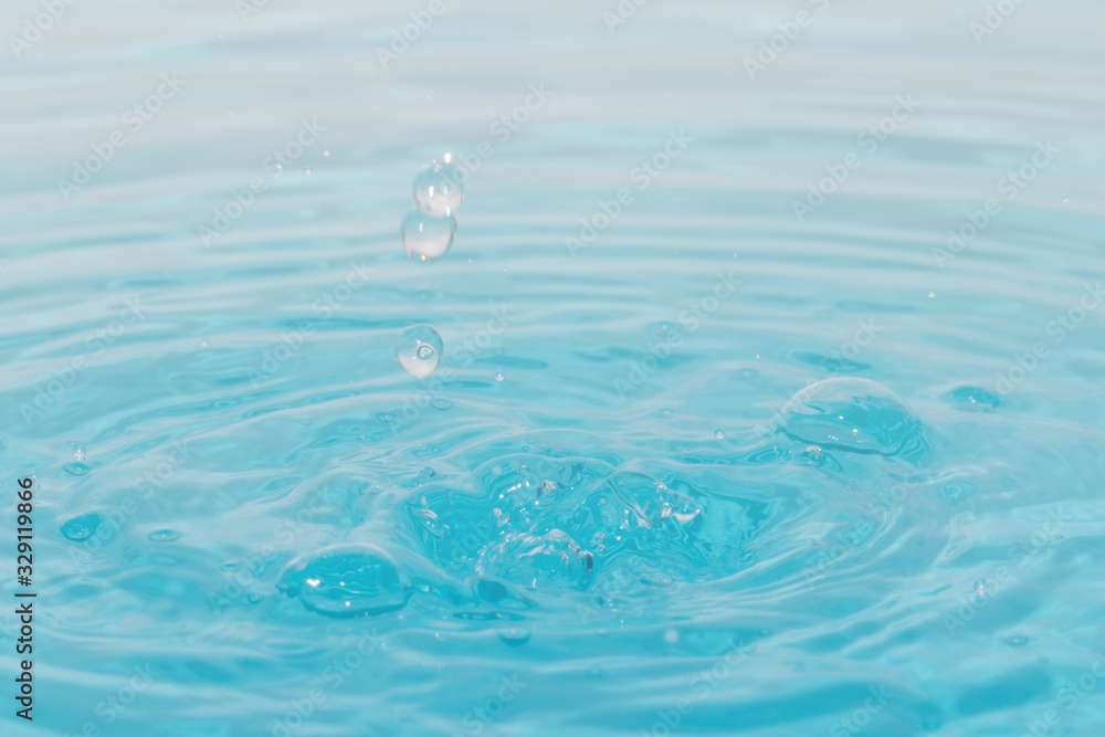 Drop of water on blue background.Water splash wallpaper. Drop of water on blue background.Water splash wallpaper.