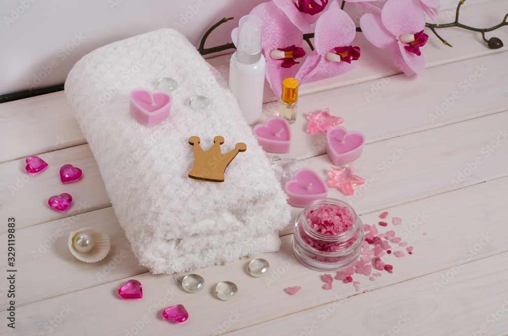 Royal spa procedure, massage as a gift. White towel, candles, salt, flowers as a decor with copy space on a white background. Anti-stress and detox treatments. Royal spa procedure, massage as a gift. White towel, candles, salt, flowers as a decor with copy space on a white background. Anti-stress and detox treatments.