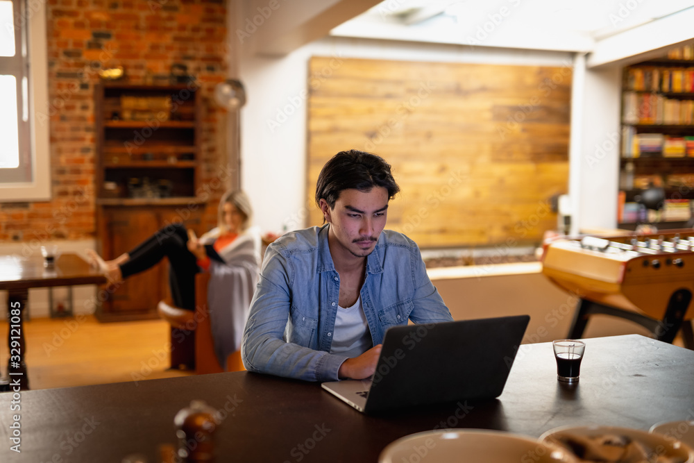 Young couple busy at home in the evening Young couple busy at home in the evening