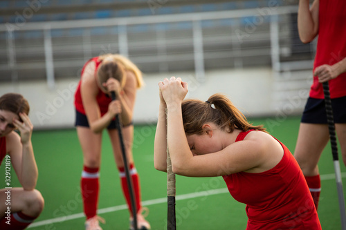 Female hockey players after the match photo