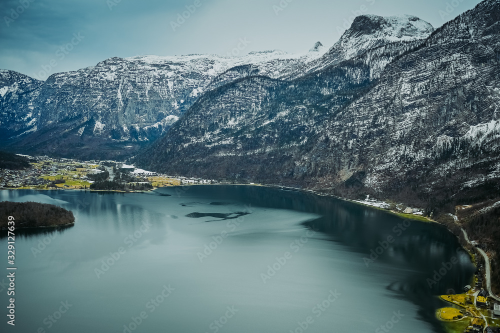 Top view from the observation deck of famous Hallstatt mountain village and alpine lake, landscape panorama, Austrian Alps, Austria. Unesco. Salzkammergut region