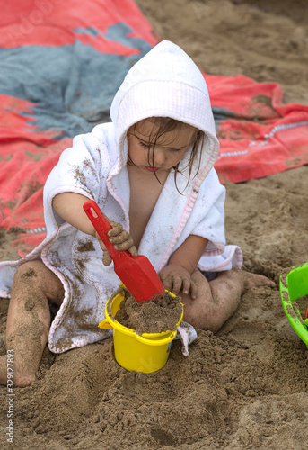 Girl. Toys. Beach. Sand. Summer. Towel. Cute © sarenac77
