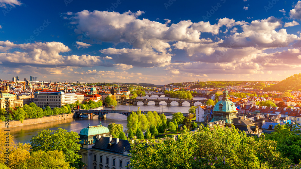 Scenic view of the Old Town pier architecture and Charles Bridge over Vltava river in Prague, Czech Republic. Prague iconic Charles Bridge (Karluv Most) and Old Town Bridge Tower at sunset, Czechia. - obrazy, fototapety, plakaty 