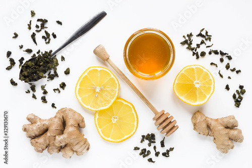 Tea with ginger  honey and lemon on white background. Isolated. Flat lay  top view
