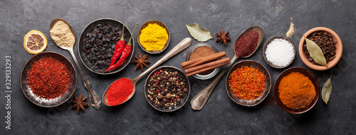 Fototapeta Various spices in bowls and spoons