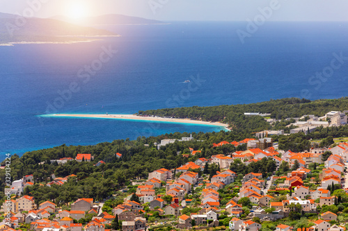 Beautiful panorama of famous Adriatic beach Zlatni Rat (Golden Cape or Golden Horn) with turquoise water , Island of Brac Croatia summertime. Famous Adriatic beach Zlatni Rat in Bol, Brac, Croatia. © daliu