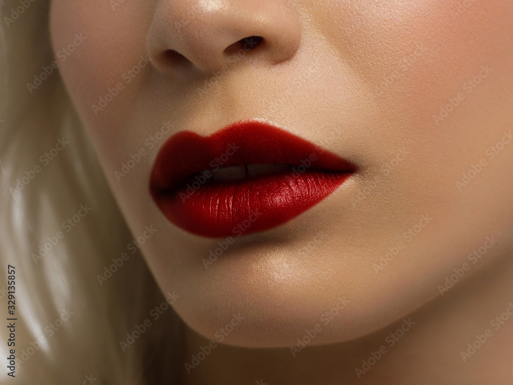 Fototapeta premium Closeup plump Lips. Lip Care, Augmentation, Fillers. Macro photo with Face detail. Natural shape with perfect contour. Close-up perfect lip makeup beautiful female mouth. Plump sexy full red lips