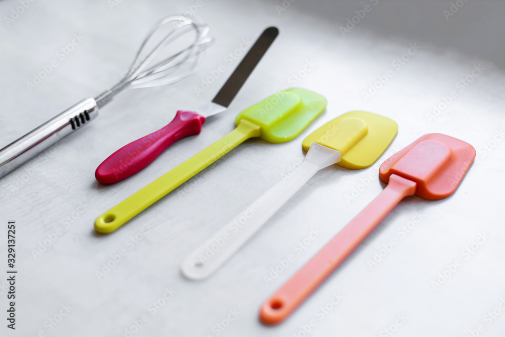 Set of multi-colored silicone spatulas, kitchen tools. Sweet pastries, recipes, cooking Set of multi-colored silicone spatulas, kitchen tools. Sweet pastries, recipes, cooking