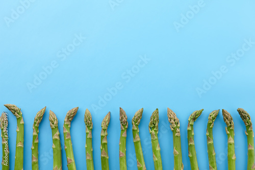 Green asparagus on blue background