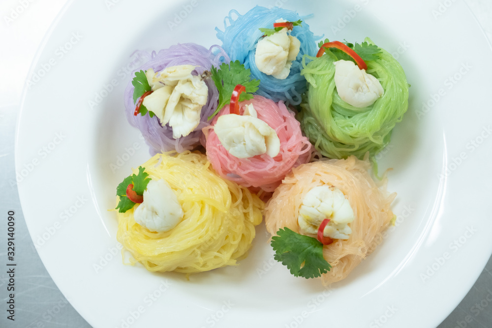 Multicolored rice noodles with crab
