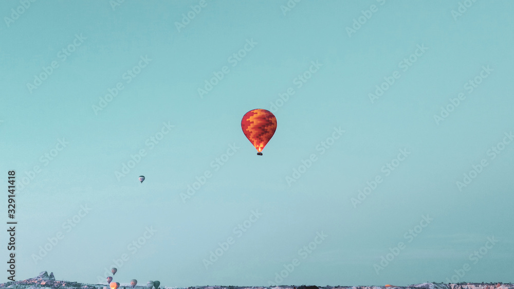 Hot air balloons preparing to fly at early morning in winter season in Cappadocia, Turkey