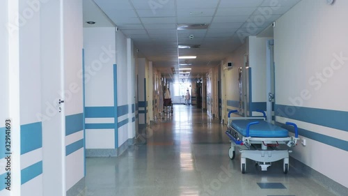 Medical bed on wheels in the hospital corridor. .