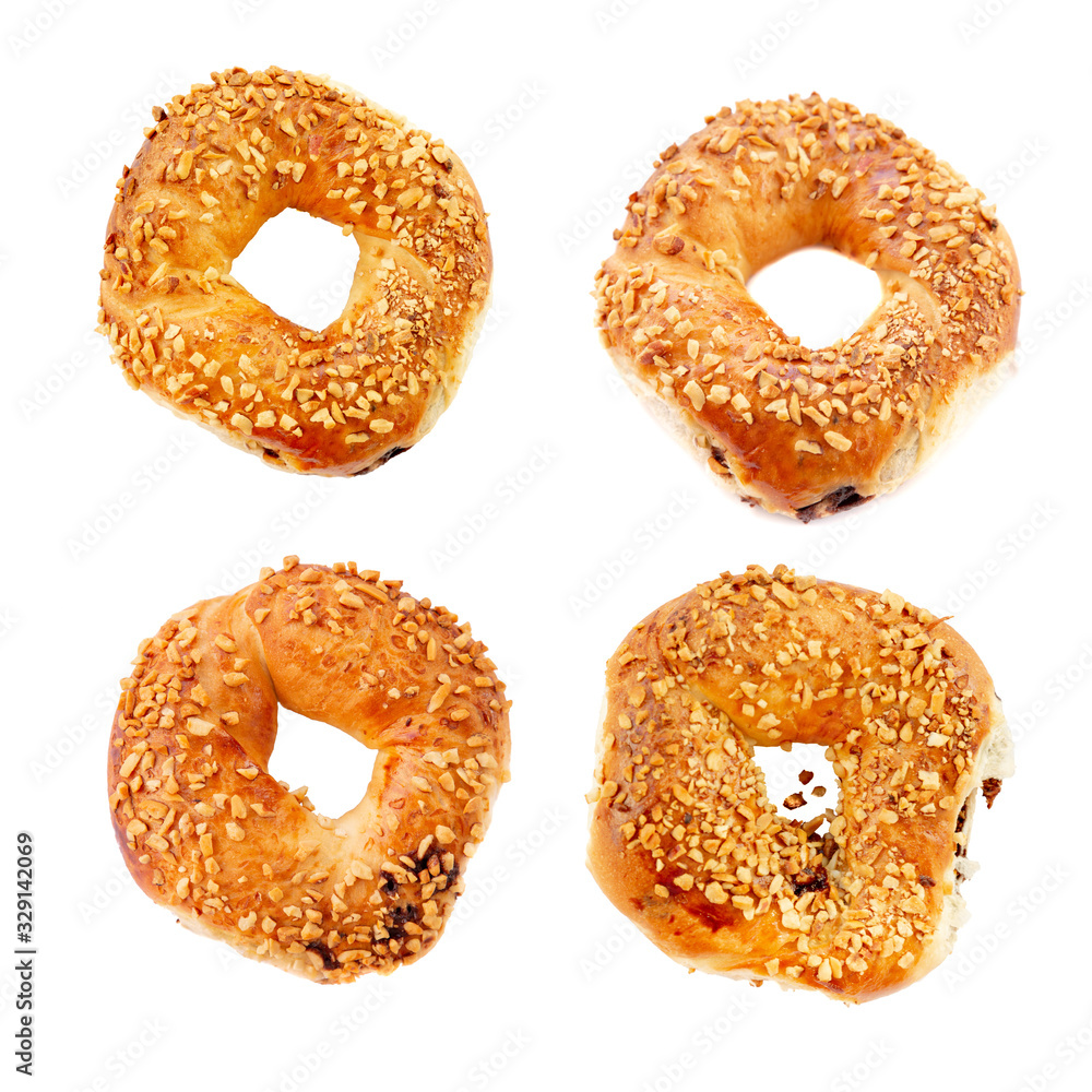 Traditional Turkish crispy bagel,simit with cream chocolate cut out on white background. Traditional Turkish crispy bagel,simit with cream chocolate cut out on white background.