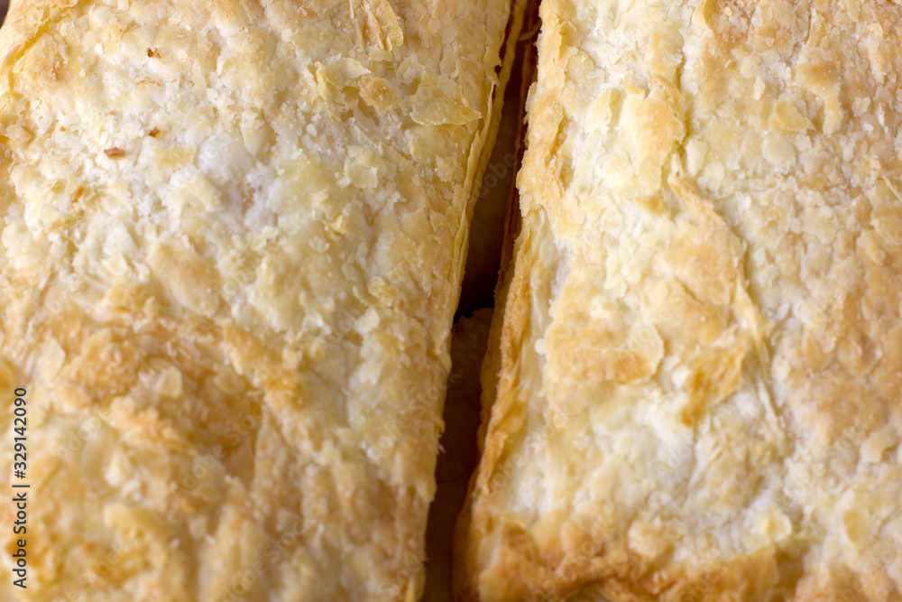 Closeup puff pastry cakes with crispy crust