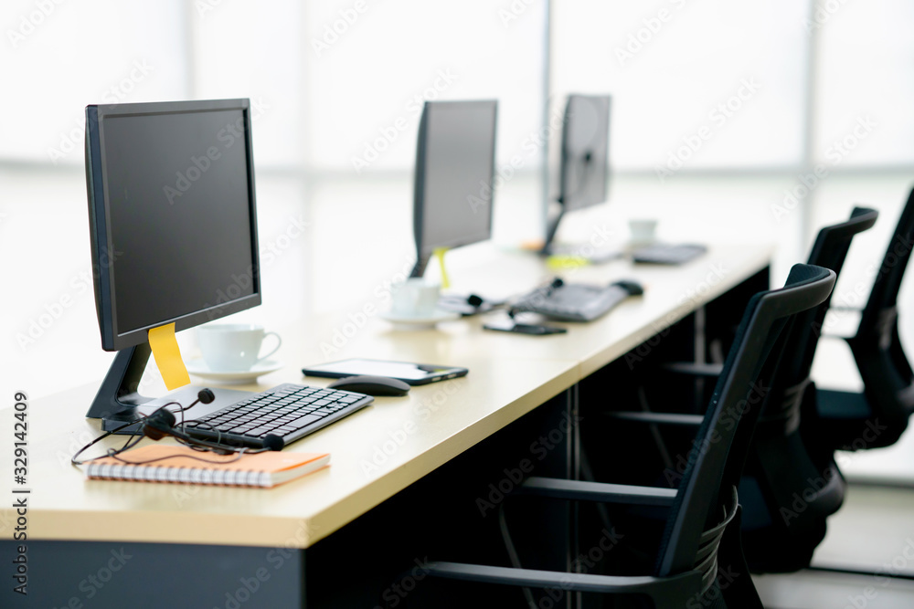 Chairs computers and headset call center in modern office Chairs computers and headset call center in modern office