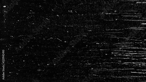 Rain water droplets slowly trickling down the window pane at night