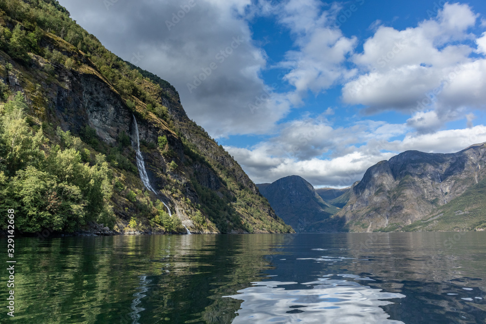 Waterfall falling in norwegian fjord Aurlandsfjord