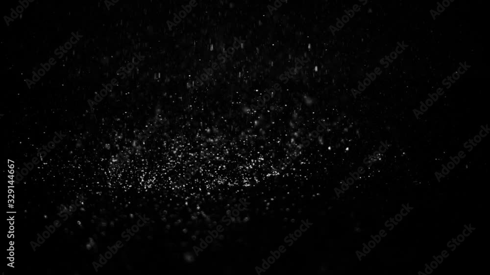 Droplets of rain falling on the surface creating splashes on an isolated background Droplets of rain falling on the surface creating splashes on an isolated background