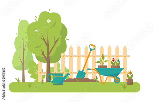 Gardening tools and trees in garden.