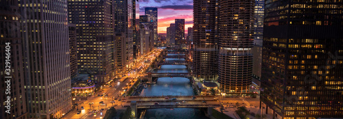 Downtown city buildings and skyline over the Chicago River Illinois USA photo