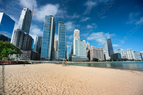 Chicago cityscape across the sand of Ohio Street Beach on Lake Michigan and Lake Shore Drive in Illinois USA © Aevan