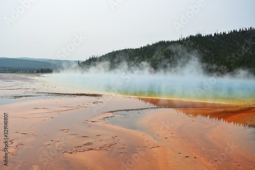 Steam above colorful lake - Yellowstone National Park
