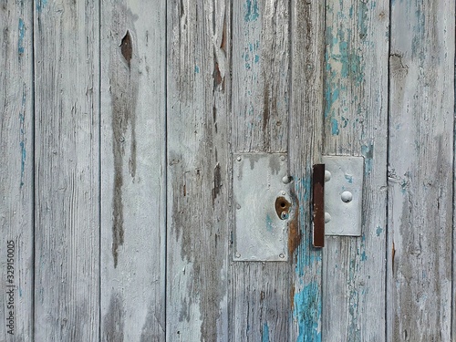 old wooden door with a lock © timepaint72