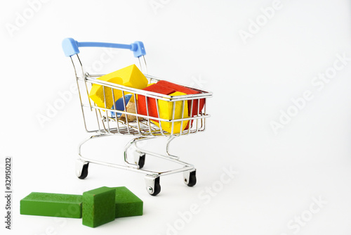 Coloring wooden toys with small shopping trolley or online chart on the white background 