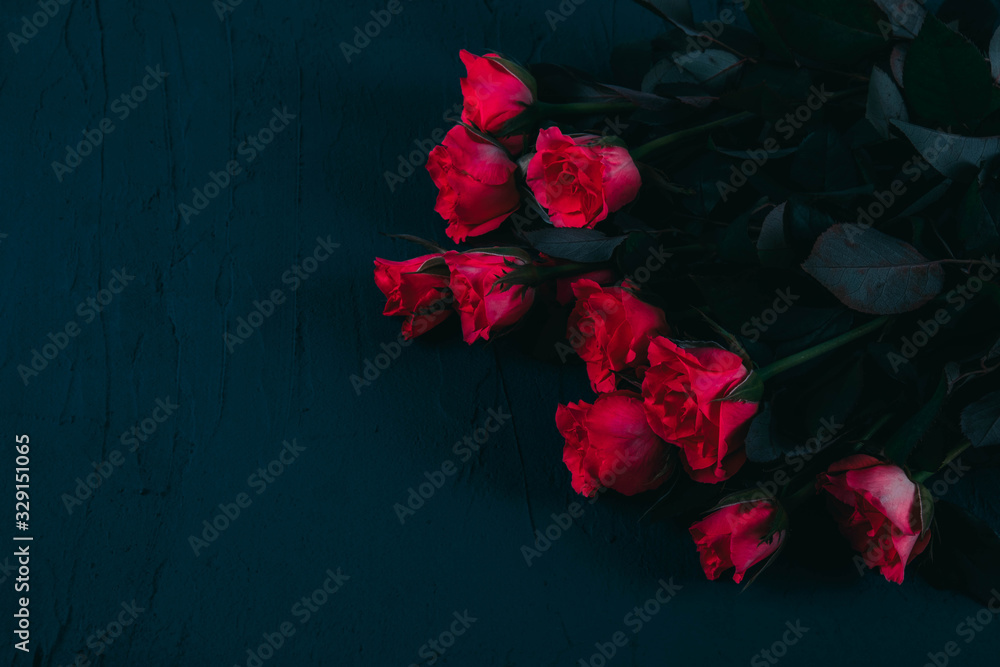 for a loved one, a bouquet of red roses lies on a table for a loved one, a bouquet of red roses lies on a table