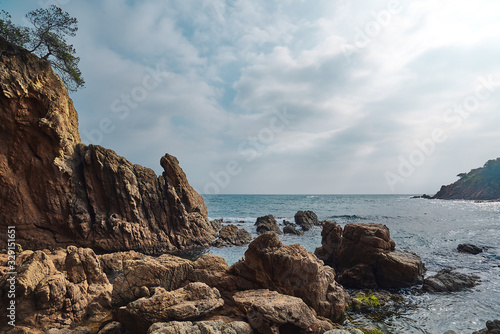 Mediterranean Landscape with rocks, pine trees and rough cliffs in Costa Brava. Blanes, Catalonia, Spain.