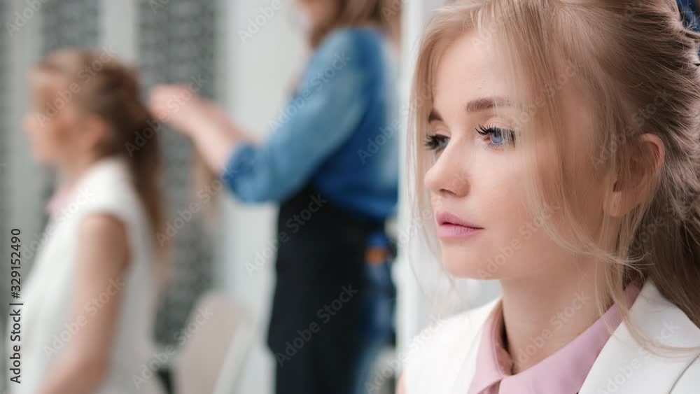 Close up face of female customer at hairdo studio during making hairstyle. 4k Dragon RED camera Close up face of female customer at hairdo studio during making hairstyle. 4k Dragon RED camera