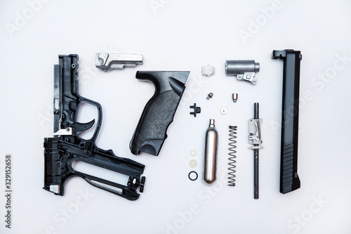 disassembled gun parts, equipment repair