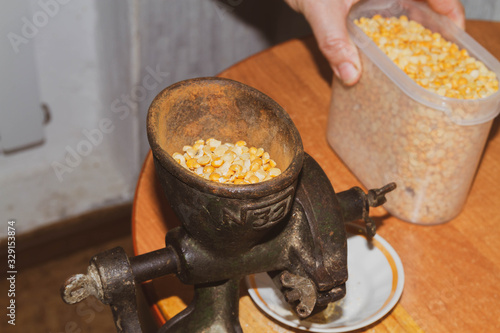 Grinding cereals for food. Manual kruporushka. An ancient device for chopping peas. photo