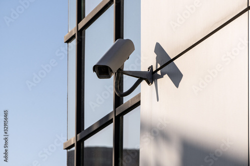 white CCTV cameras on the street, security in the city. covert shooting of what is happening. modern technologies and equipment