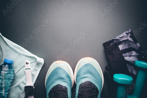 Healthy lifestyle, sport or athlete's equipment set on black background. Flat lay. Top view with copy space.