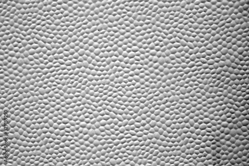 Bubbled metal sheet texture in black and white.