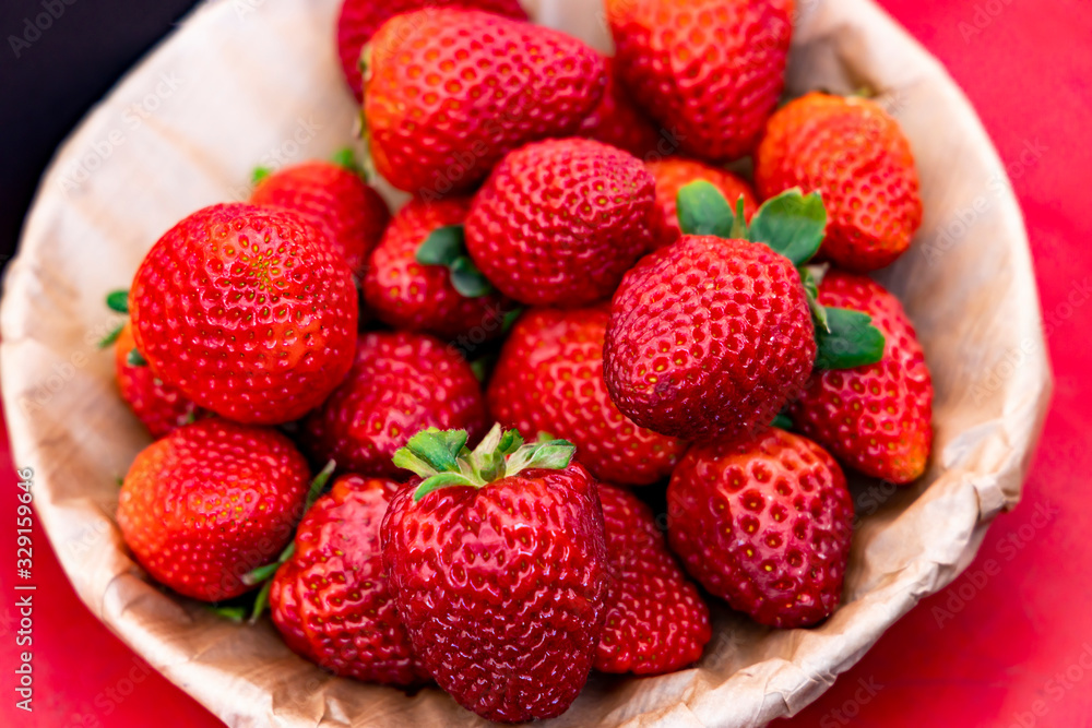 Fresh juicy strawberries in a plate.